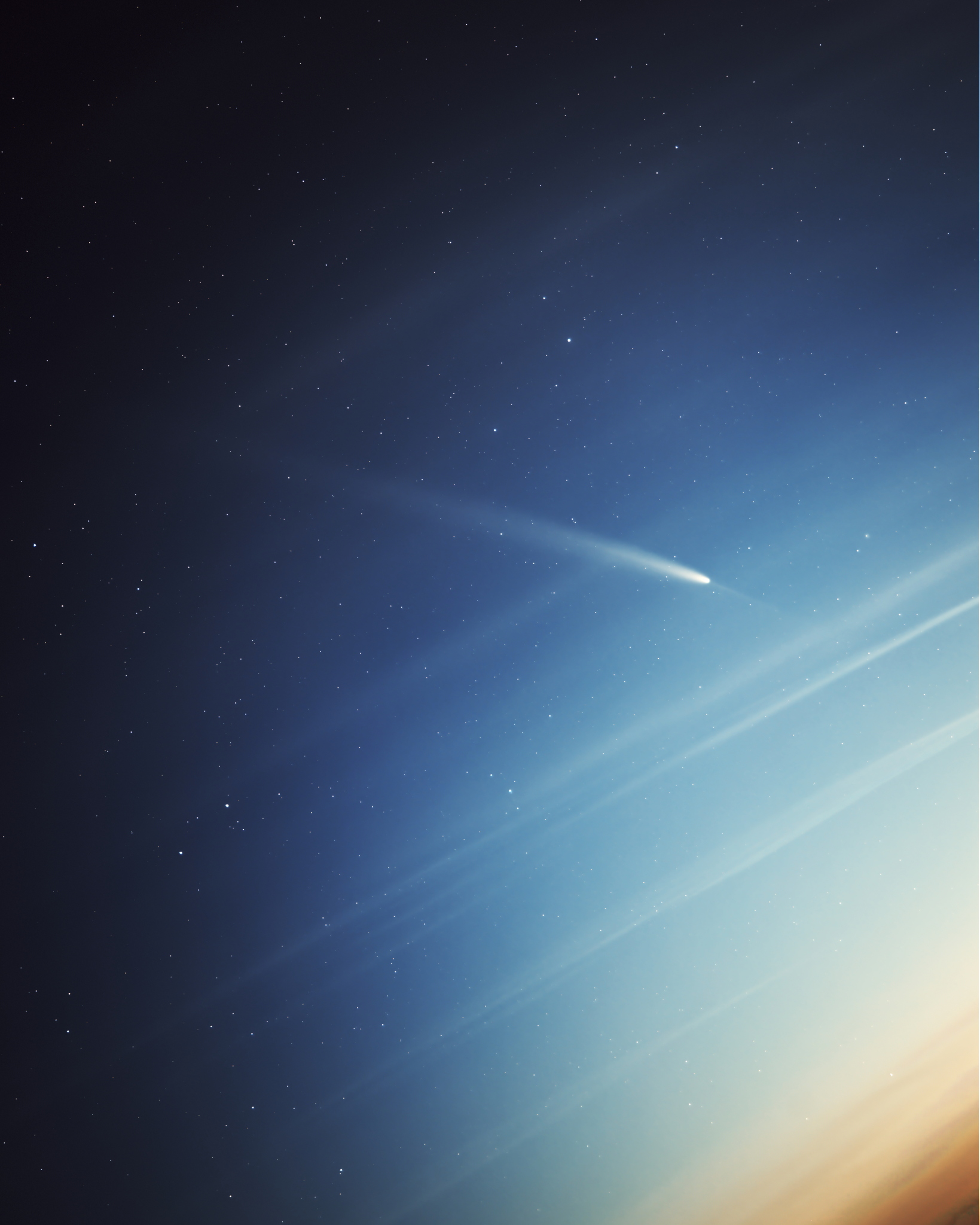 Comet A3 with its distinctive tail and anti-tail visible against a gradient sky, created from four stacked 2-minute exposures using a star tracker.